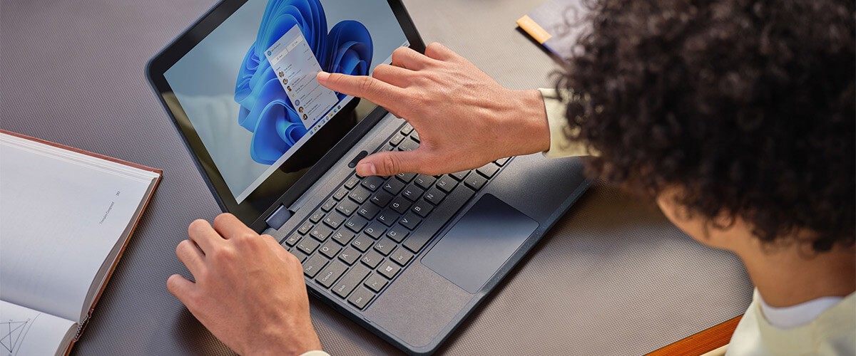 Student touching Microsoft Surface device
