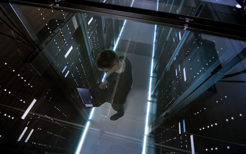 Overhead view of IT technician working in modern data center