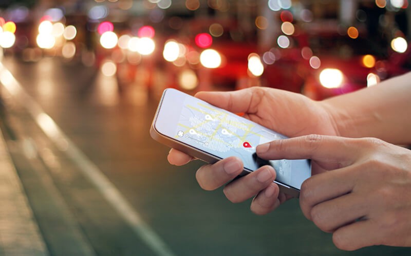 Close up of map data on mobile device in city