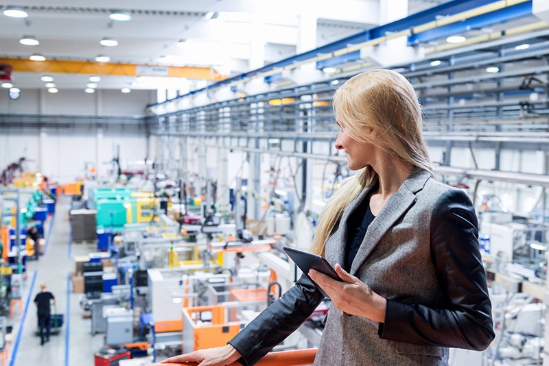 Integrated and personalized for your business Business owner works on tablet computer in warehouse