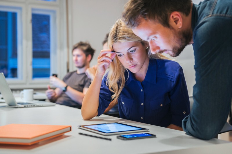 Cross-platform mobile development caters to thousands of different devices Design team works on application development process