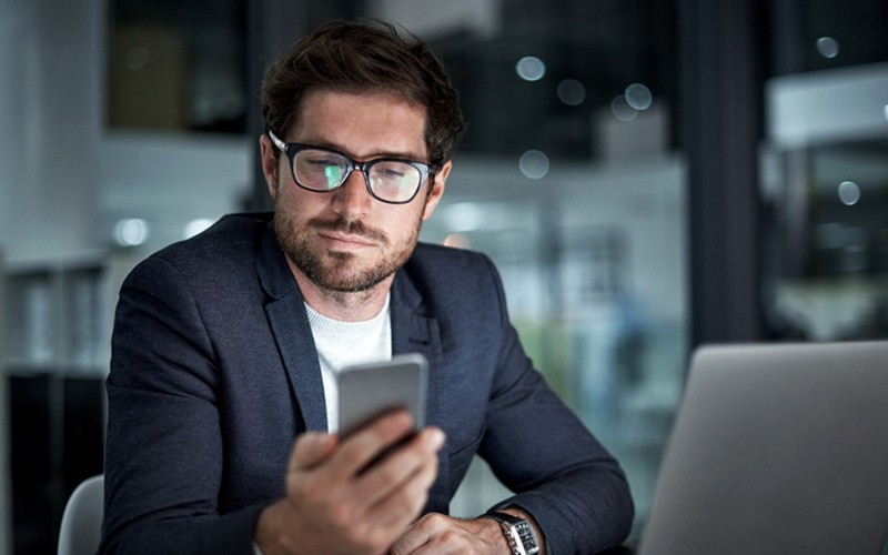 Business professional reviews new software deployments