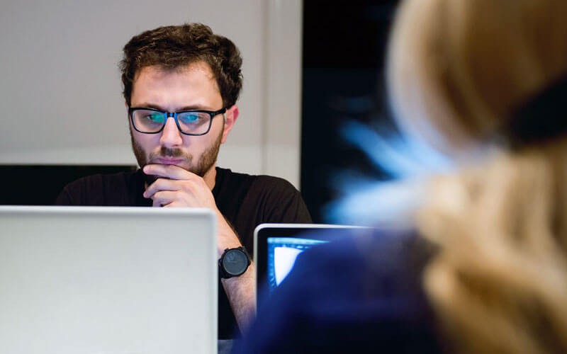 We’ll help you understand each application’s dependencies Businessman on laptop computer using application discovery tools