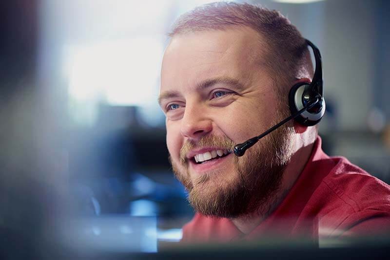 Customer support representative on call with client