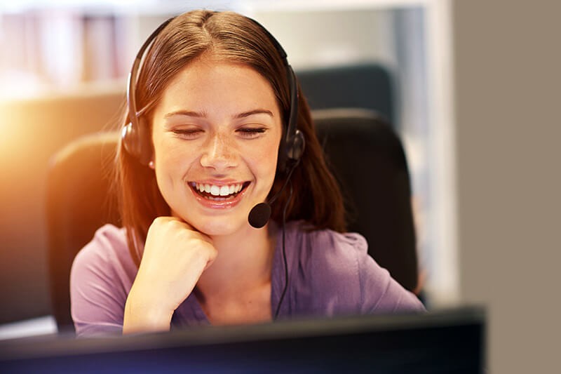 Smiling customer support representative ready to help
