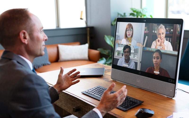 Businessman on video call using Cisco Webex on desktop computer