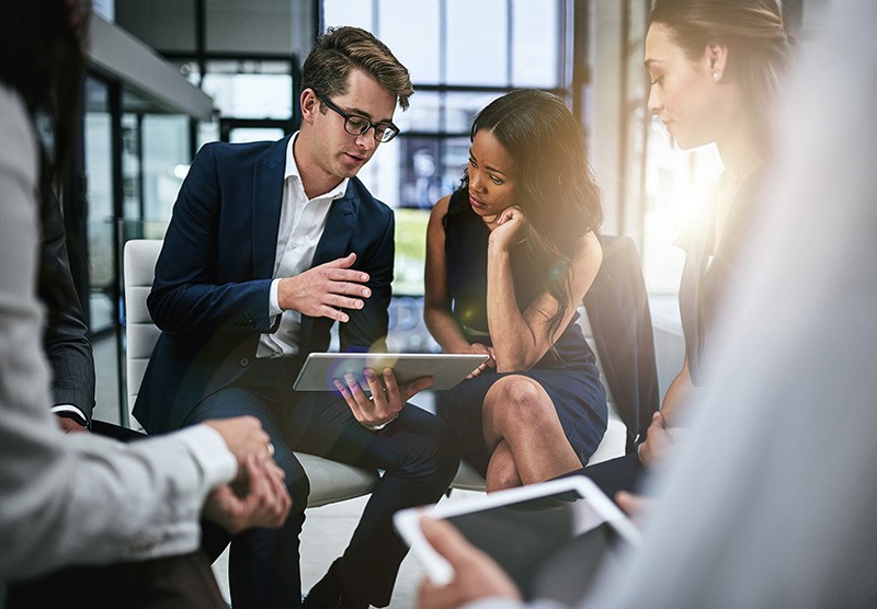 Businessman going over Microsoft 365 security solutions to team