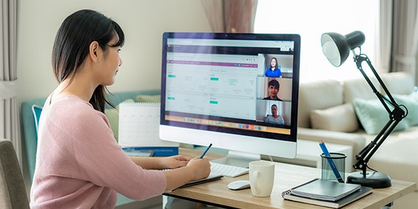 Business professional using automated workflows and self-service tools. 