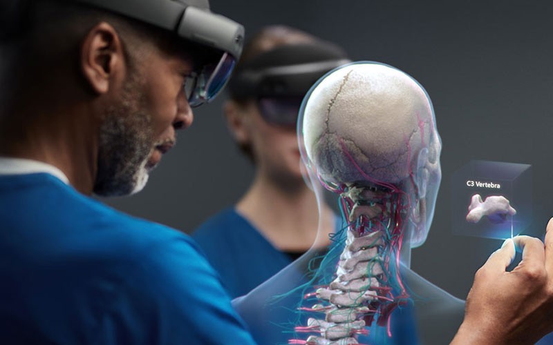 Federal healthcare worker uses Microsoft HoloLens 2 to research human virus effects. Augmented reality headset. AR headset